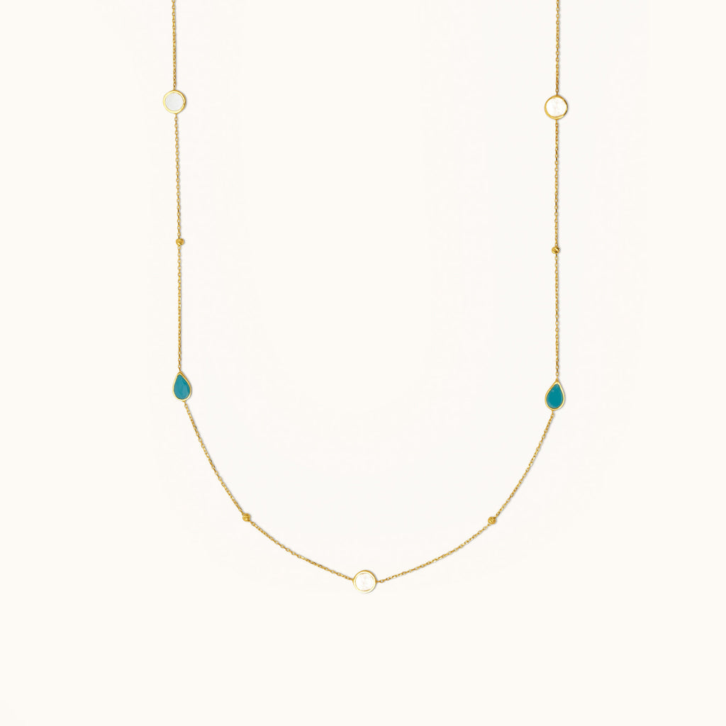 Front view of 18K gold dual-wear necklace with turquoise stone and mother of pearl accents on a delicate chain
