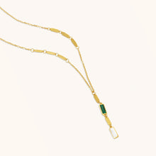 Load image into Gallery viewer, Close-up detail of 18K gold necklace showcasing malachite stone, mother-of-pearl accent, and polished gold links.