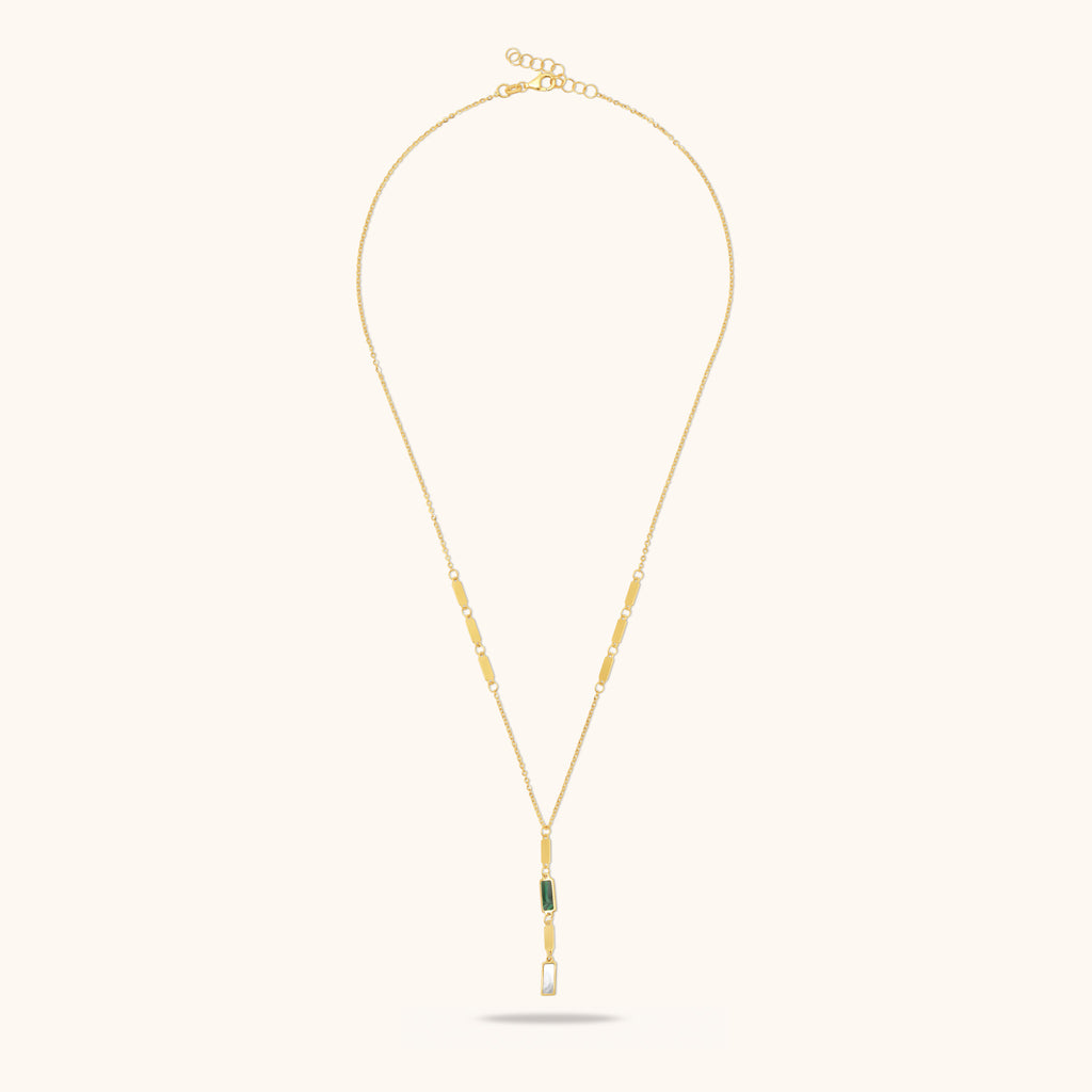Full length view of 18K gold necklace with malachite and mother-of-pearl pendant and adjustable chain design.