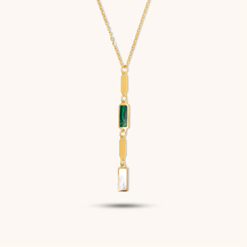 Front view of 18K gold necklace featuring a vertical pendant with green malachite accent and mother-of-pearl inlay.Front view of 18K gold necklace featuring a vertical pendant with green malachite accent and mother-of-pearl inlay.