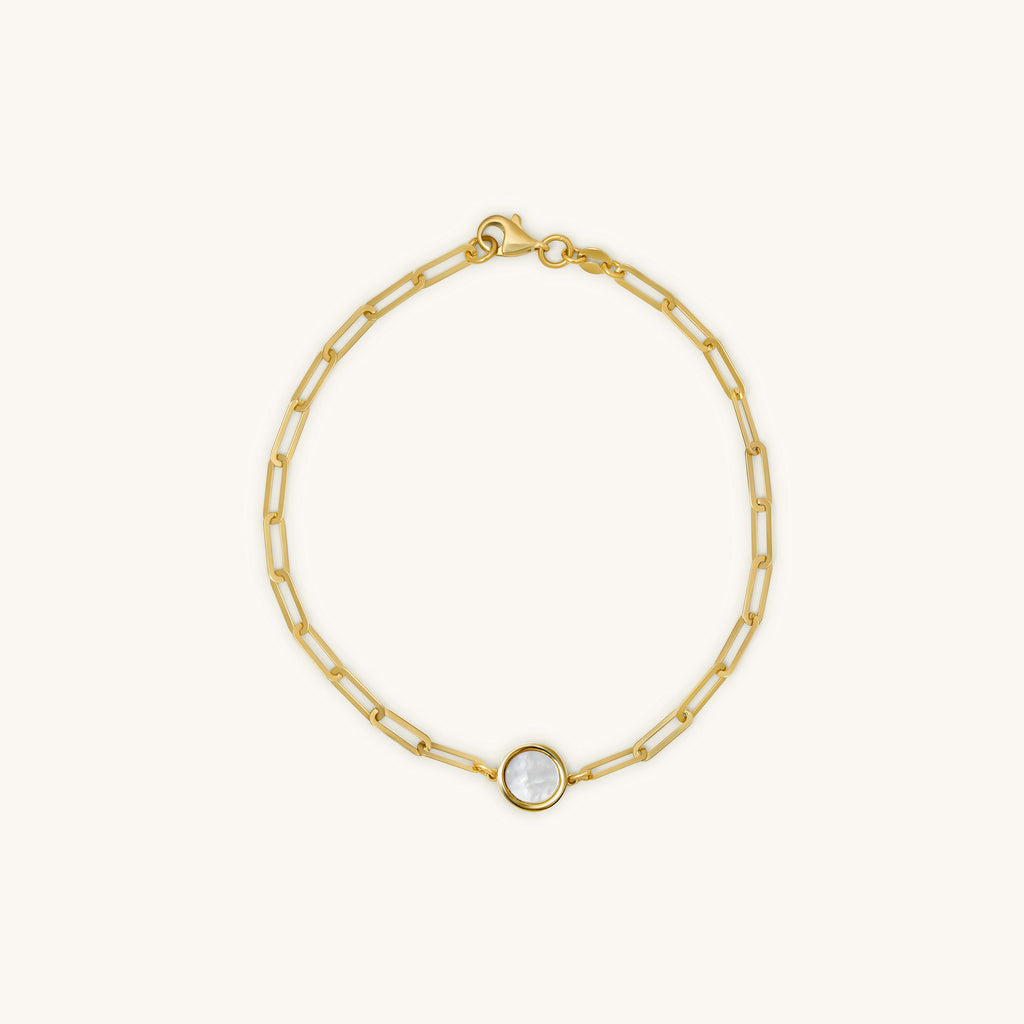 Front view of 18K gold rectangular chain bracelet with round mother-of-pearl inlay centerpiece