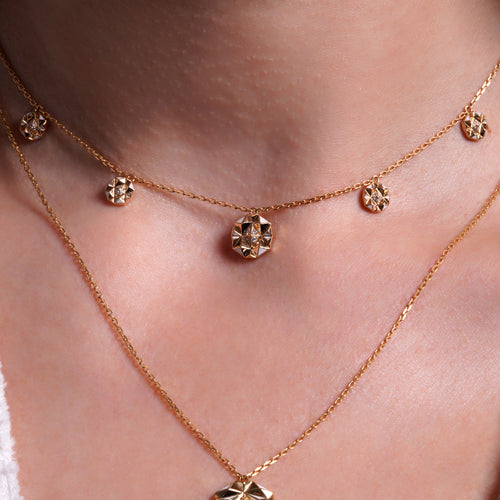 women wearing 18K gold slopes charm diamond choker layered on the neckline