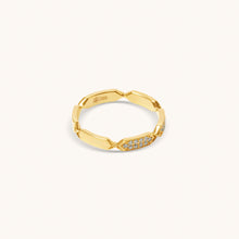 Load image into Gallery viewer, A gold with diamond ring facets and white enamel detailing, displayed against a white background