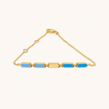 Load image into Gallery viewer, An 18k gold bracelet with two-tone blue facets, displayed against a white background.
