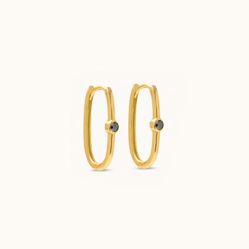 Pair view of minimalist 18K gold hoop earrings with black diamond accents for an elegant everyday look
