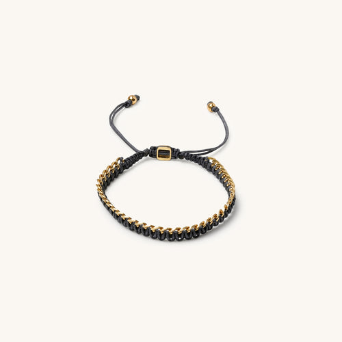 An 18k gold bracelet for women with intertwined grey threads, featuring a fully adjustable design.
