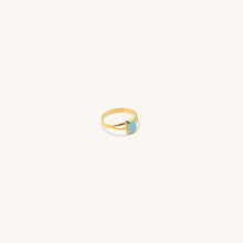 Load image into Gallery viewer, An 18k gold ring with a blue square enamel inlay set within a metal frame on a white background.