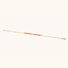 Load image into Gallery viewer, Joubijoux Facets Fusion gold bracelet with orange and pink enamel bar stones