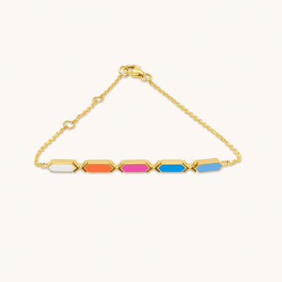 A sleek 18k Facets Jazzy gold bracelet with vibrant multicolored facets positioned along a gold chain to catch light and attention.