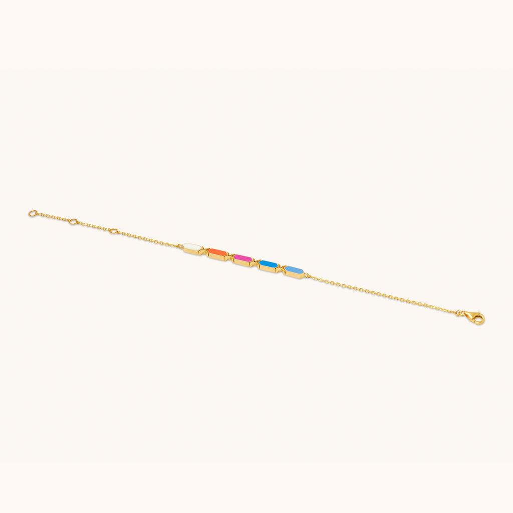 Top view of Joubijoux Facets Jazzy 18K gold bracelet with multi-colored enamel detailing