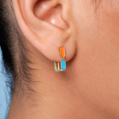 Worn view of Joubijoux Facets Jazzy 18K gold hoop earrings showing flip design on ear