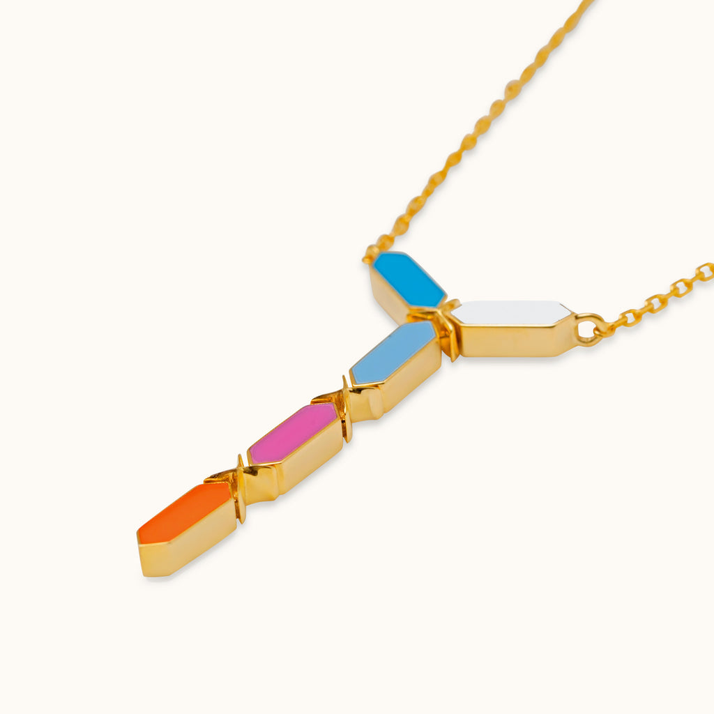 Close-up of Joubijoux Facets Jazzy 18K gold necklace highlighting multicolor enamel geometric pendant craftsmanship