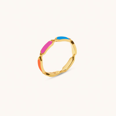 Angled view of Joubijoux Facets Jazzy 18K gold ring with blue, pink, orange and white enamel