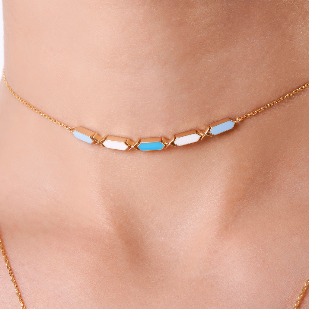 Joubijoux Facets Sky 18K gold choker necklace with blue and white enamel worn on neck