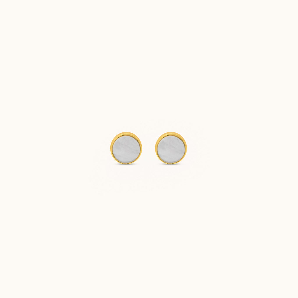 Front view of Joubijoux gold earrings featuring 18K yellow gold studs with round mother of pearl inlay