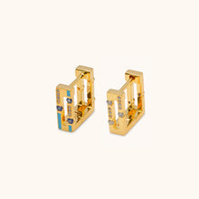 Load image into Gallery viewer, Side view of Joubijoux gold hoop earrings with blue sapphire stones set in blue enamel