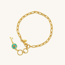 Load image into Gallery viewer, Front view of 18K yellow gold bracelet with blue enamel key pendant and polished rectangular chain links