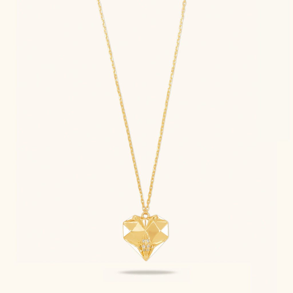 Front view of Joubijoux gold necklace design featuring 18K heart-shaped pendant with white enamel and VS diamonds