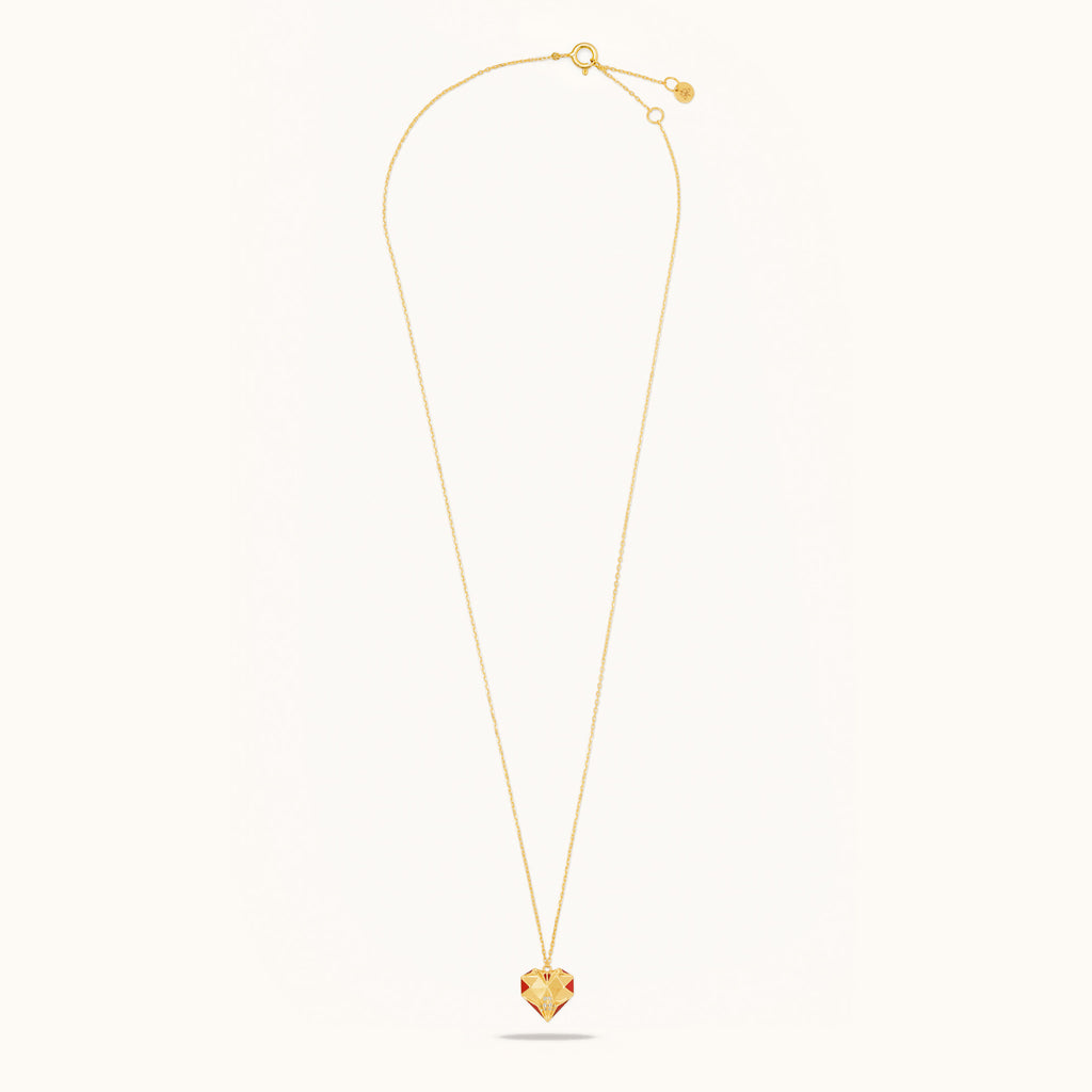Flat lay view of Joubijoux gold necklaces for women showing full 18K gold chain with heart diamond pendant