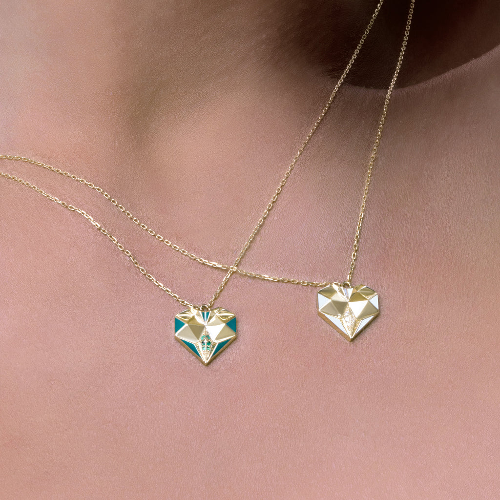 Worn view of Joubijoux gold necklaces for women showcasing 18K heart emerald necklace with green enamel on model neckline