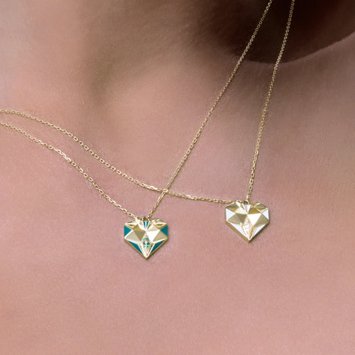 Worn view of Joubijoux gold necklaces for women showcasing 18K heart emerald necklace with green enamel on model neckline