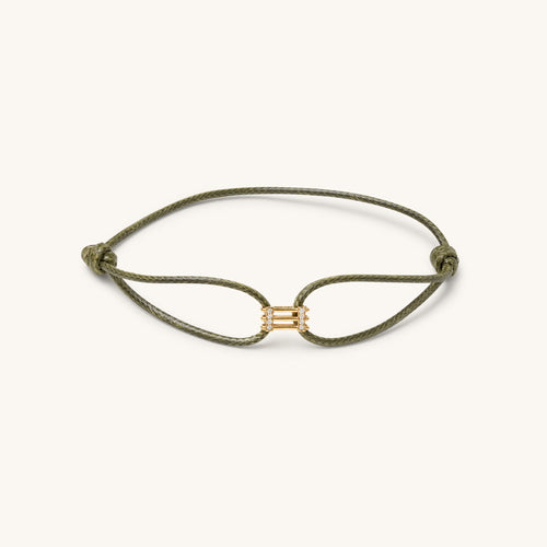 Front view of Kaleido Triad gold bracelet in 18K yellow gold featuring three parallel lines with VS diamond accents