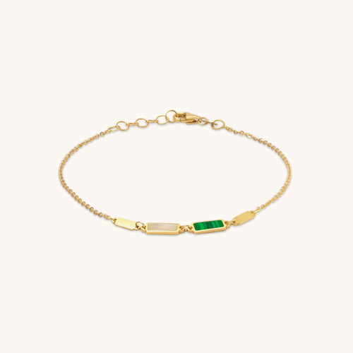 18K gold Mozaic bracelet featuring rectangular malachite and mother-of-pearl accents on a fine gold chain