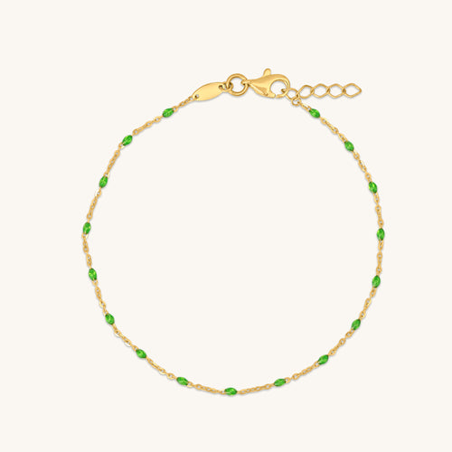 18K gold raindrop bracelet with green enamel accents, minimal chain design on white background