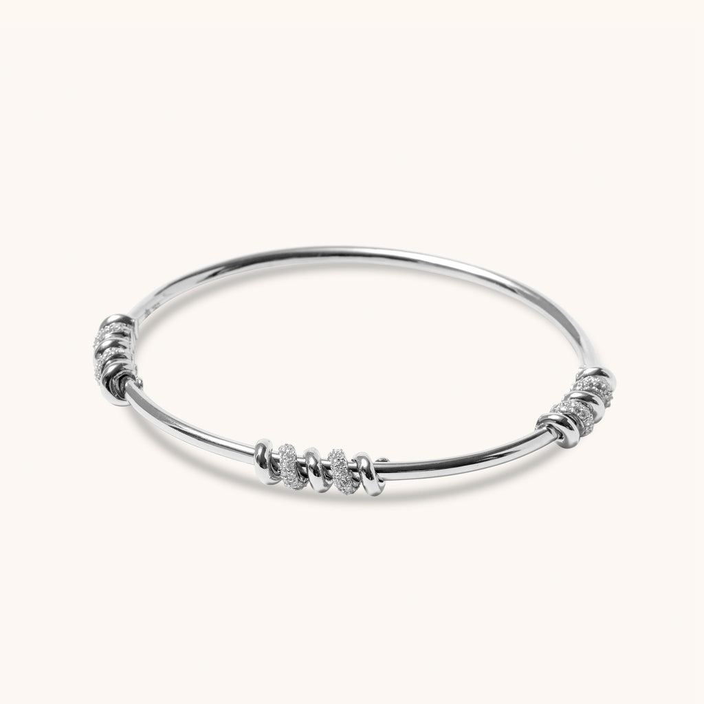 Full view of 18K white gold screw-style diamond bangle