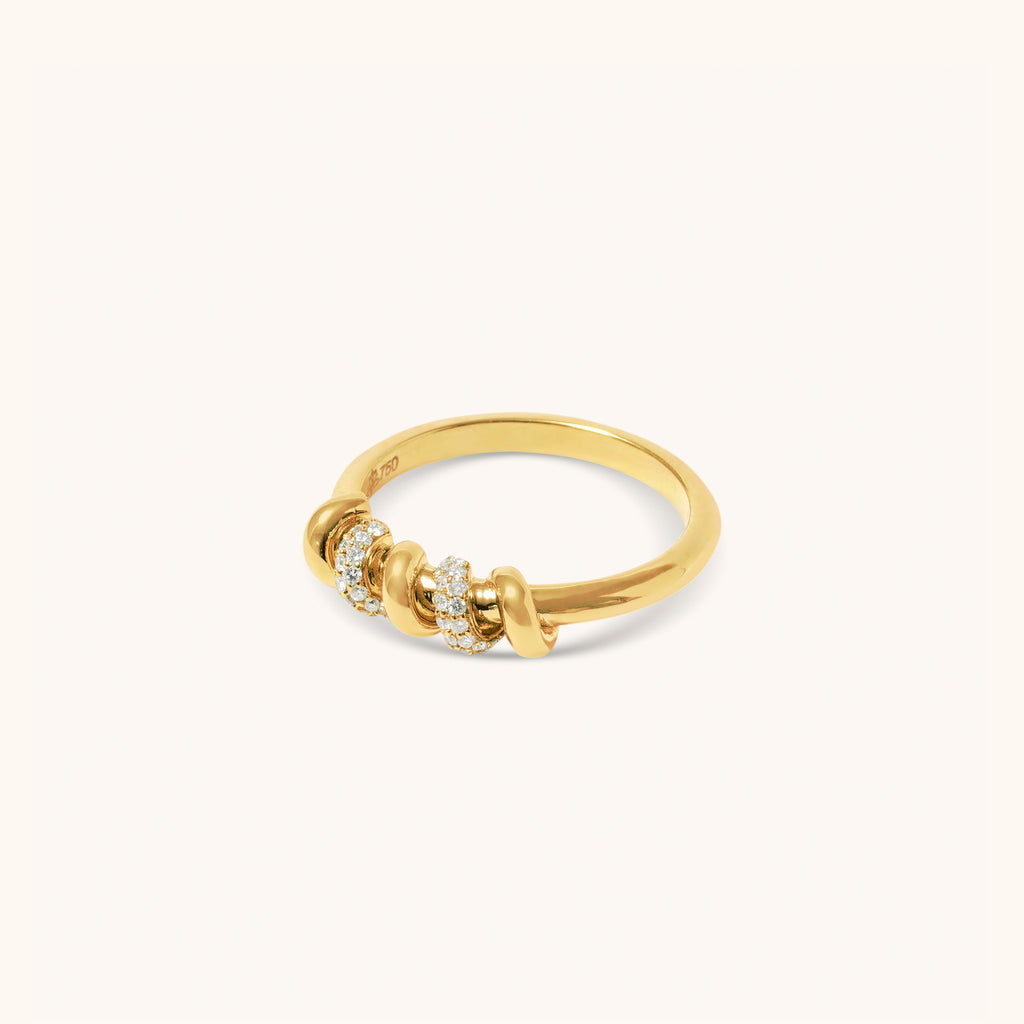 Side angle of yellow gold diamond ring featuring screw-inspired detailing