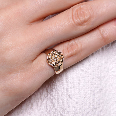 Slopes pinky diamond ring worn on hand showing geometric gold design