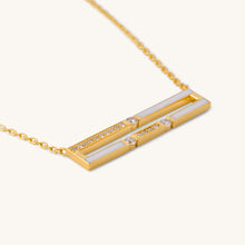 Load image into Gallery viewer, Close-up view of Versa Diamond Double Line gold necklace design highlighting diamond-set double line pendant with white enamel