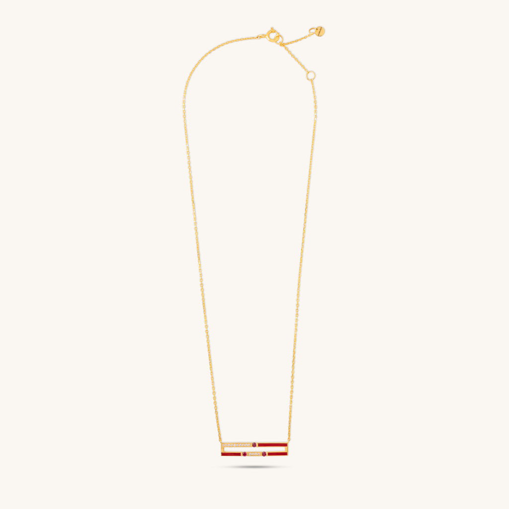 Full length view of Versa diamond and ruby necklace showing adjustable gold chain