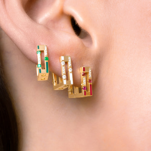 Versa diamond and ruby hoop earrings worn on ear showing reversible enamel design