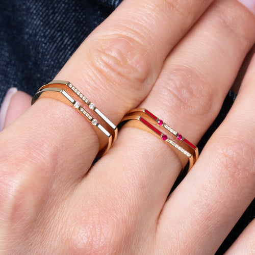 Versa diamond and white enamel ring worn on finger in 18K gold