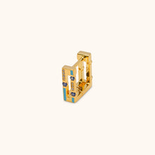 Load image into Gallery viewer, Side profile of Versa Jazzy gold hoop earrings highlighting reversible blue and pink enamel design in 18K yellow gold