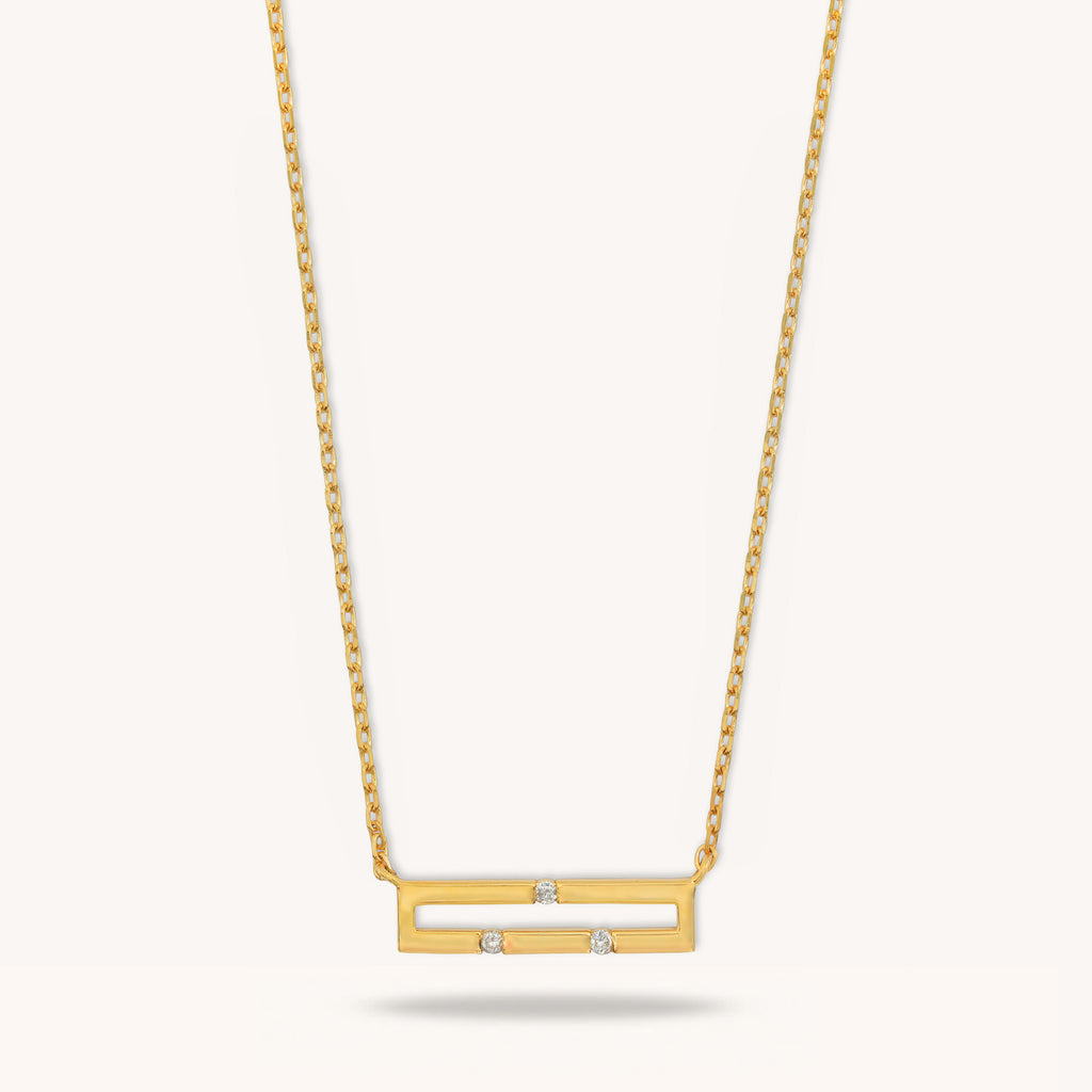 Front view of Versa Mini 18K yellow gold necklace with three natural diamonds