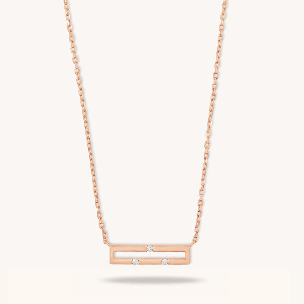 Front view of Versa Mini 18K rose gold necklace with three natural diamonds