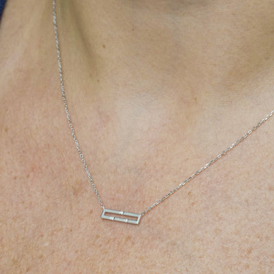 Versa Mini 18K white gold diamond necklace worn on neckline